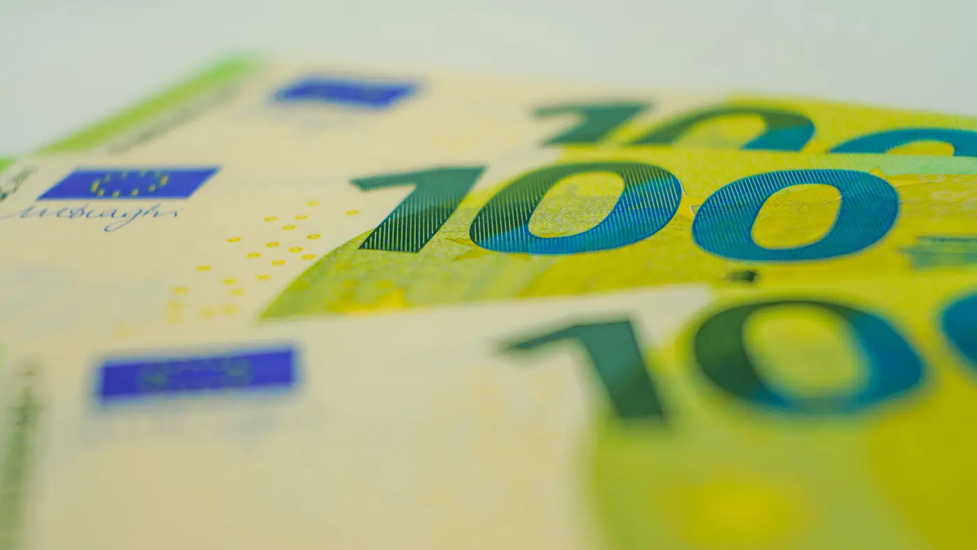 Euro banknotes in close-up with focus on 100 denomination. Perfect for financial themes.