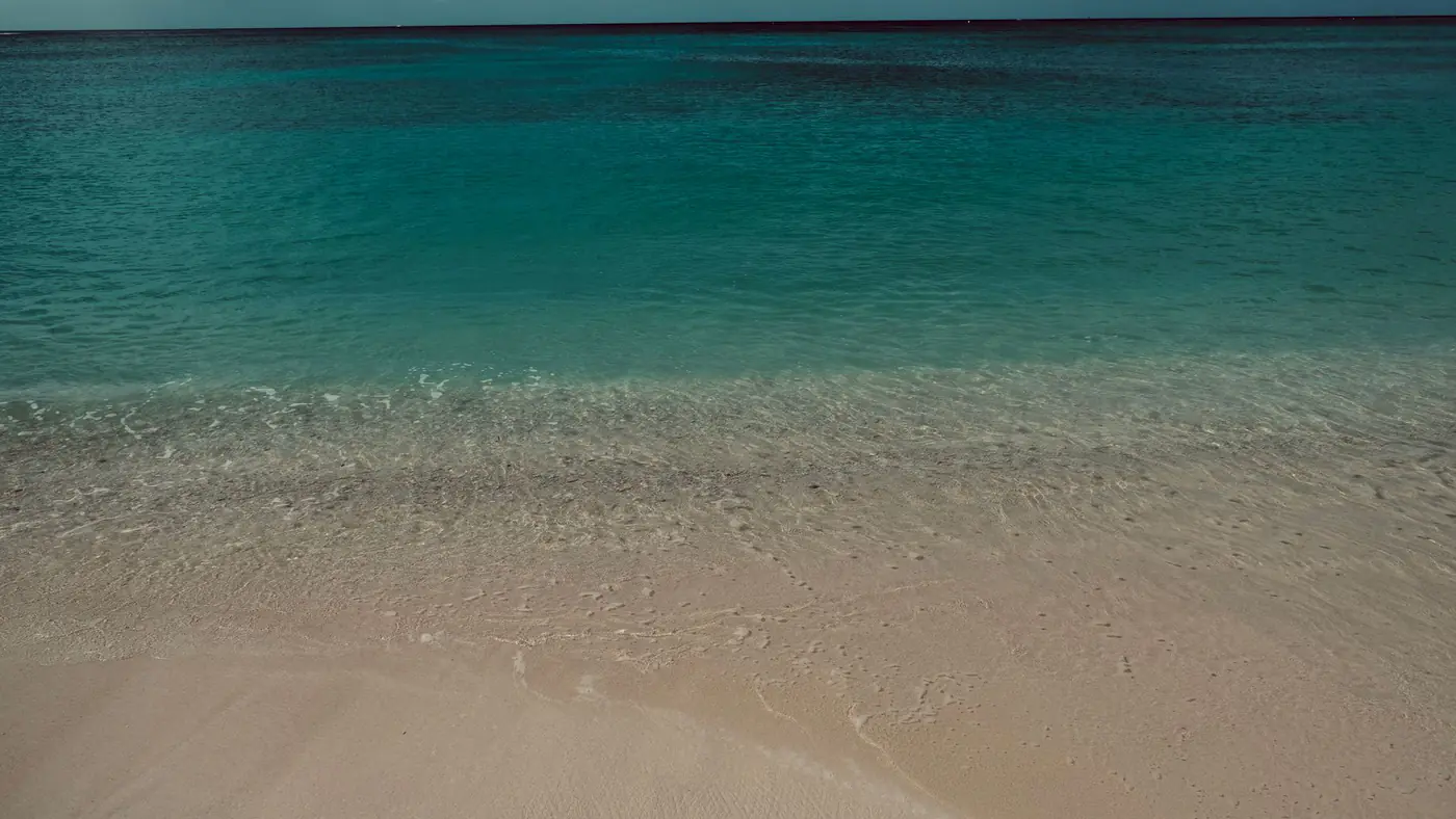 Discover the serene beach and crystal-clear waters of Cuba, perfect for relaxation and escape.