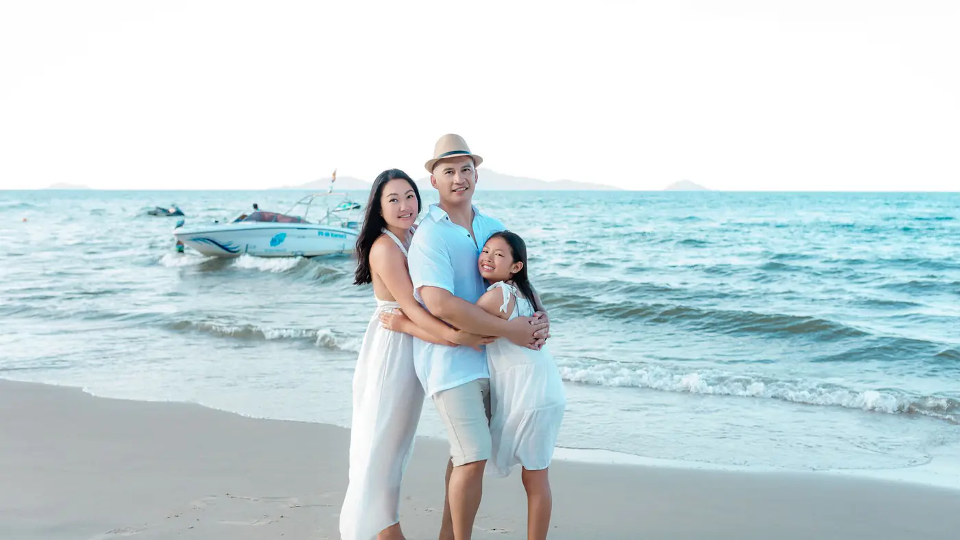 Happy family bonding on the beach in Hội An, enjoying the summer sun and sea.